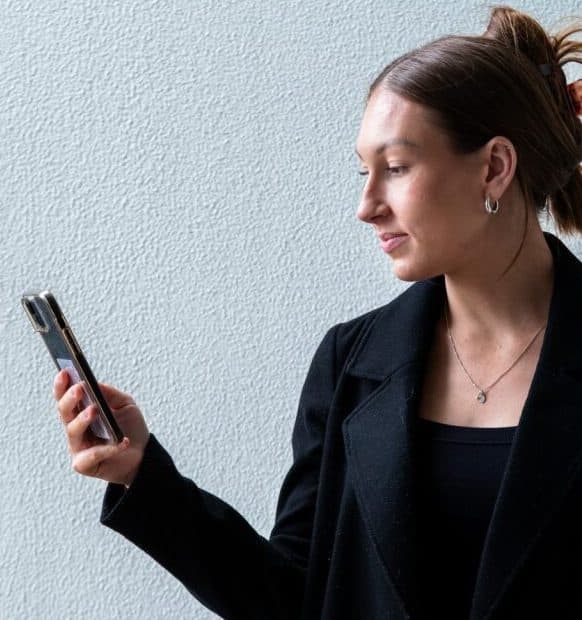 Brink team member with a phone