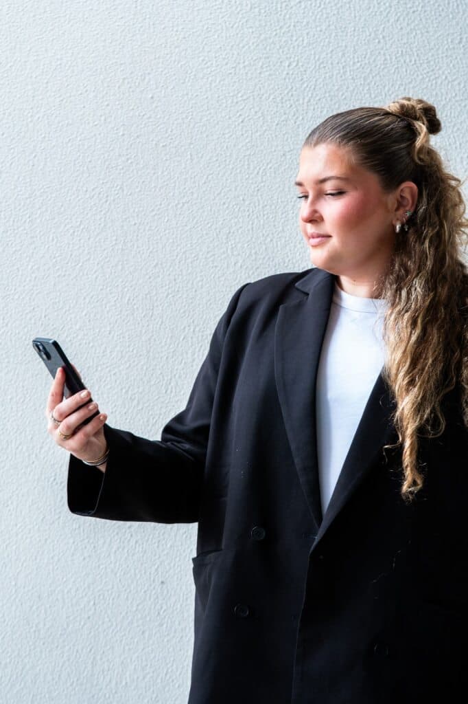 Brink team member holding a phone