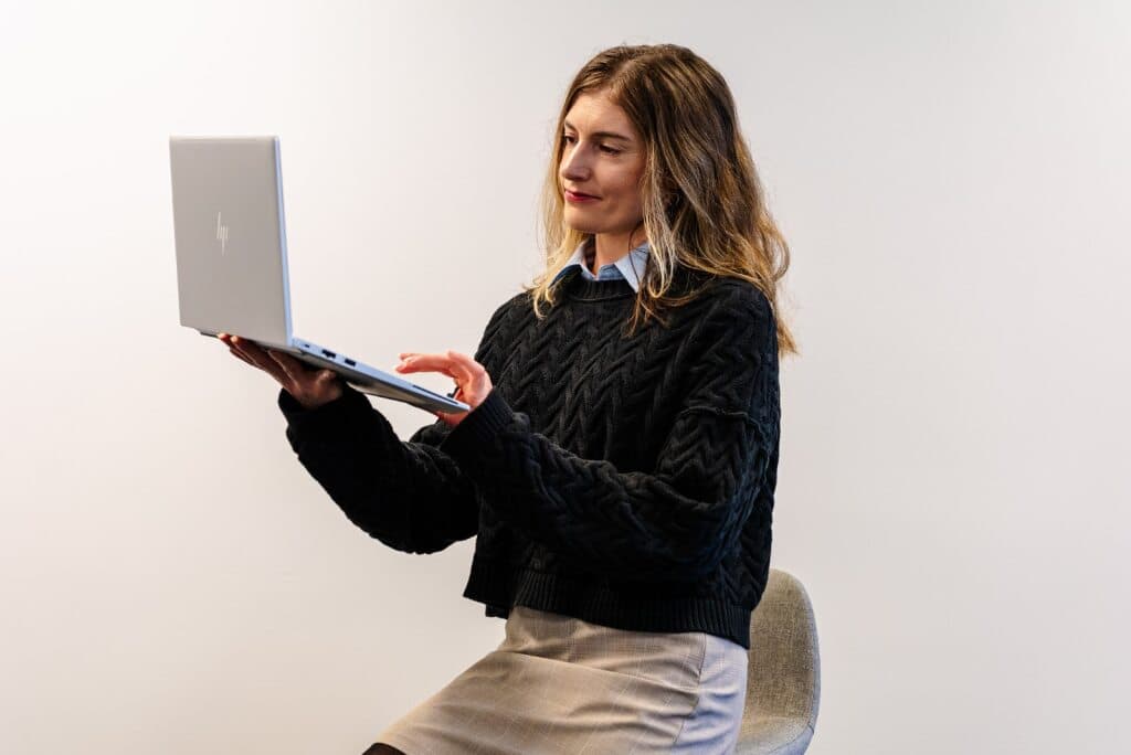 Brink team member holding a laptop