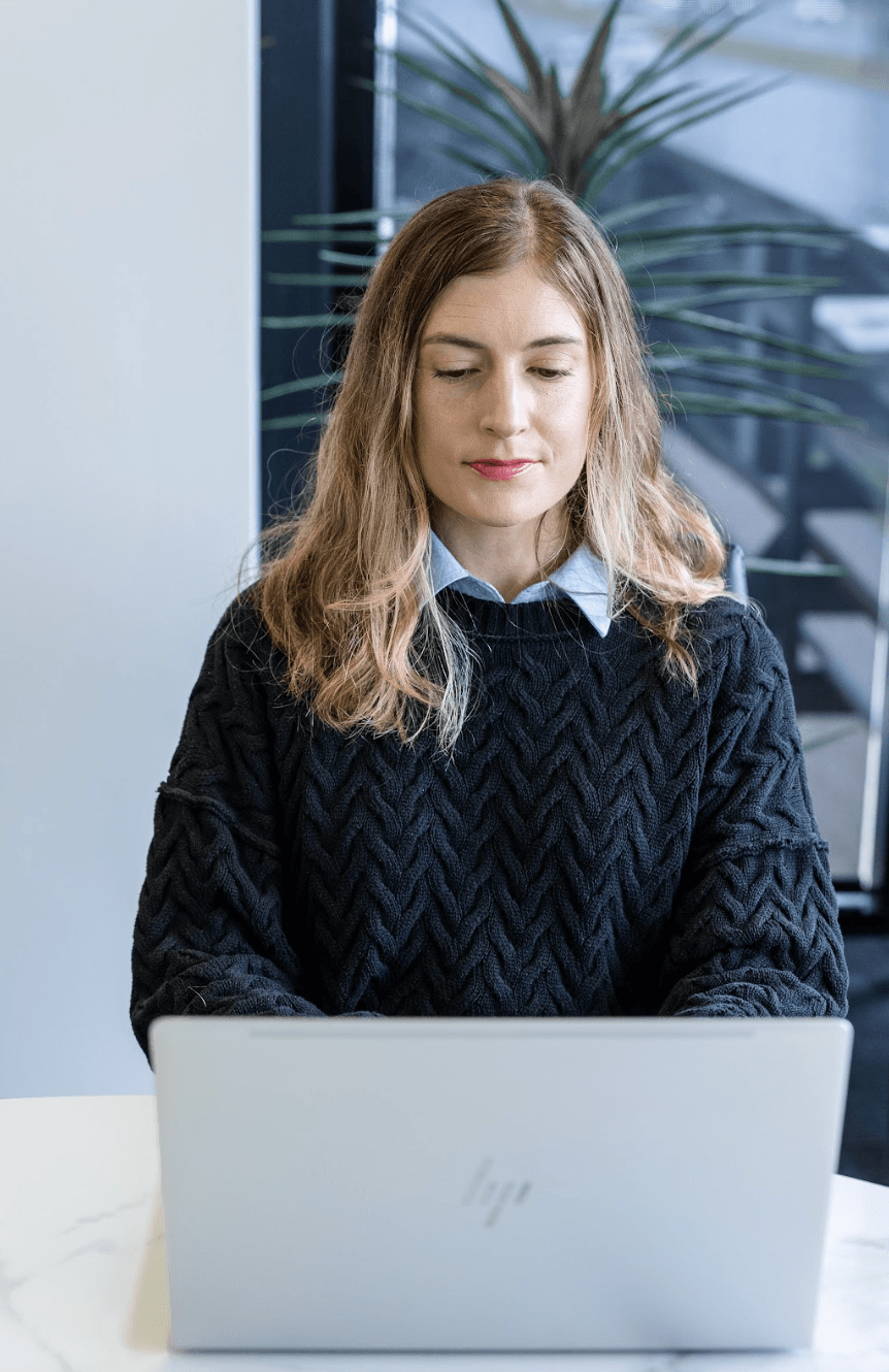 Brink team member working at a laptop