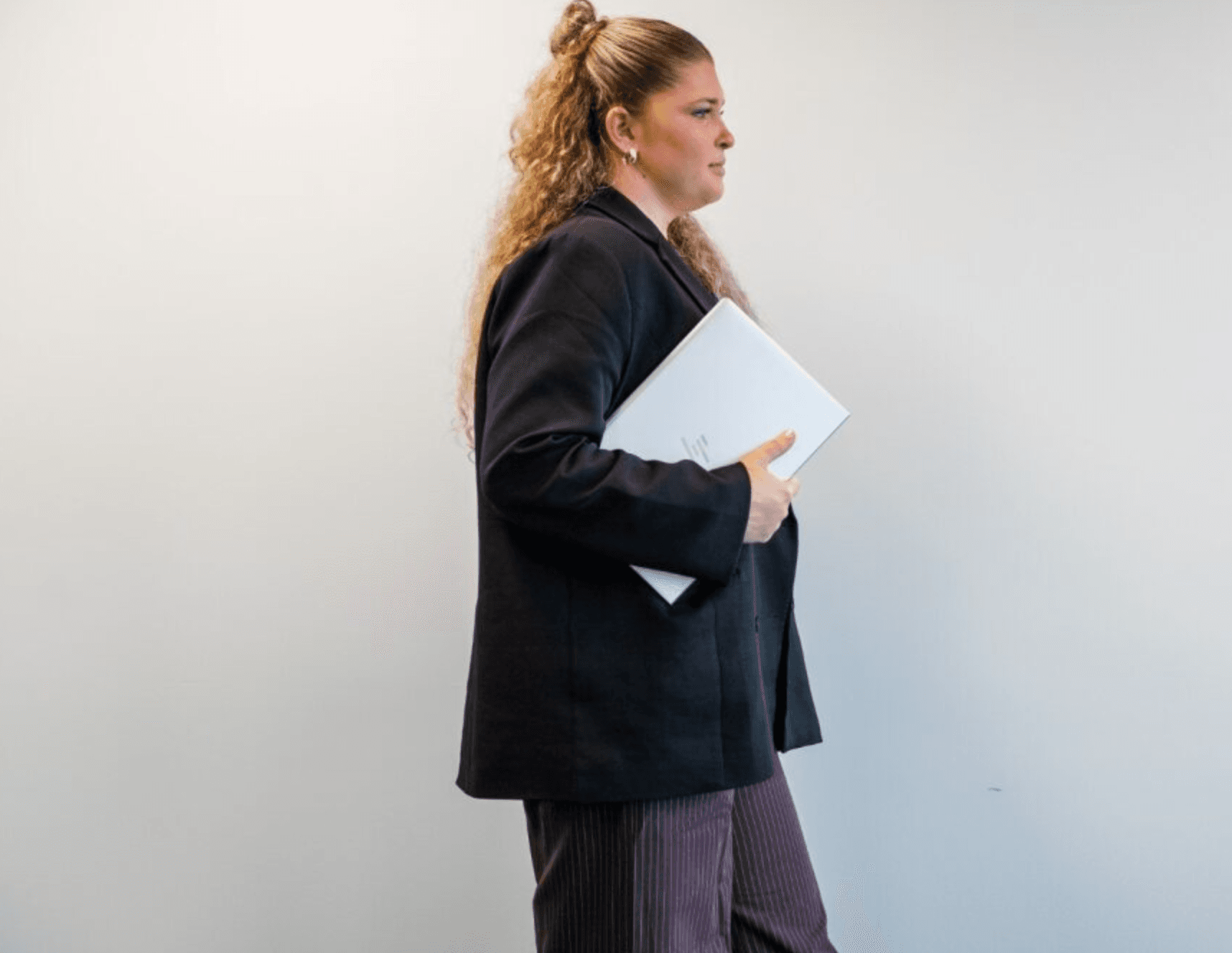 Brink team member carrying a laptop