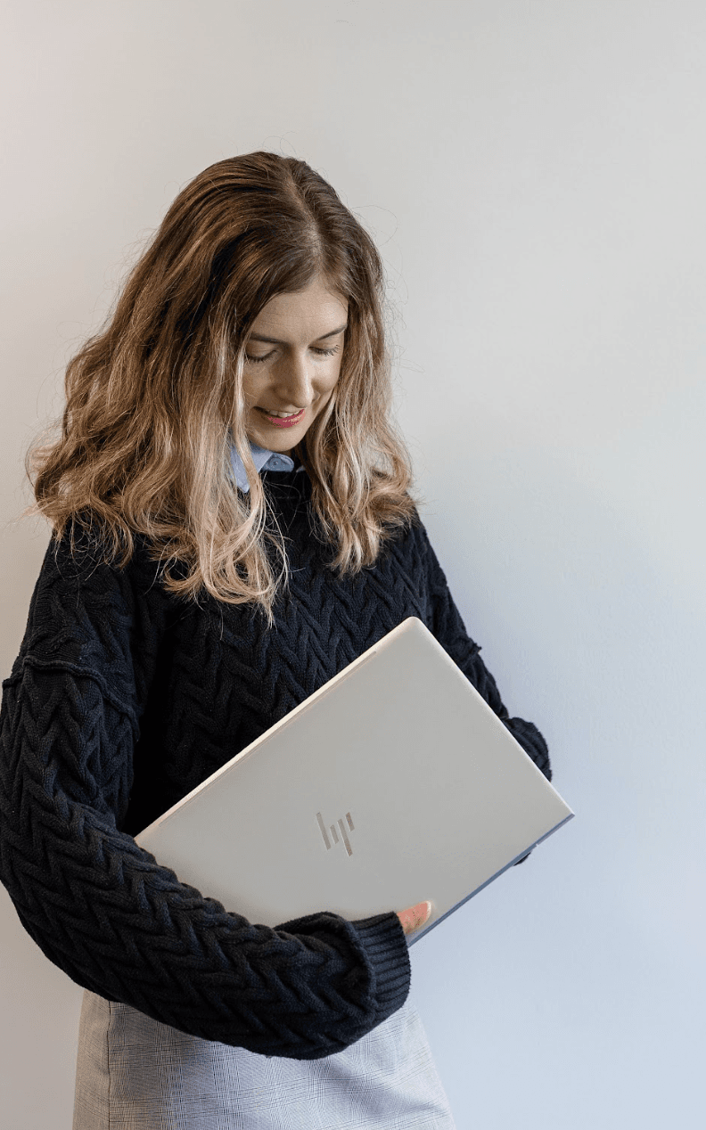 Brink team member holding a laptop
