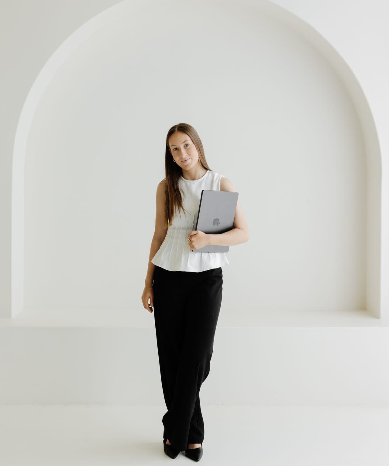 Cara with a client folder in the studio
